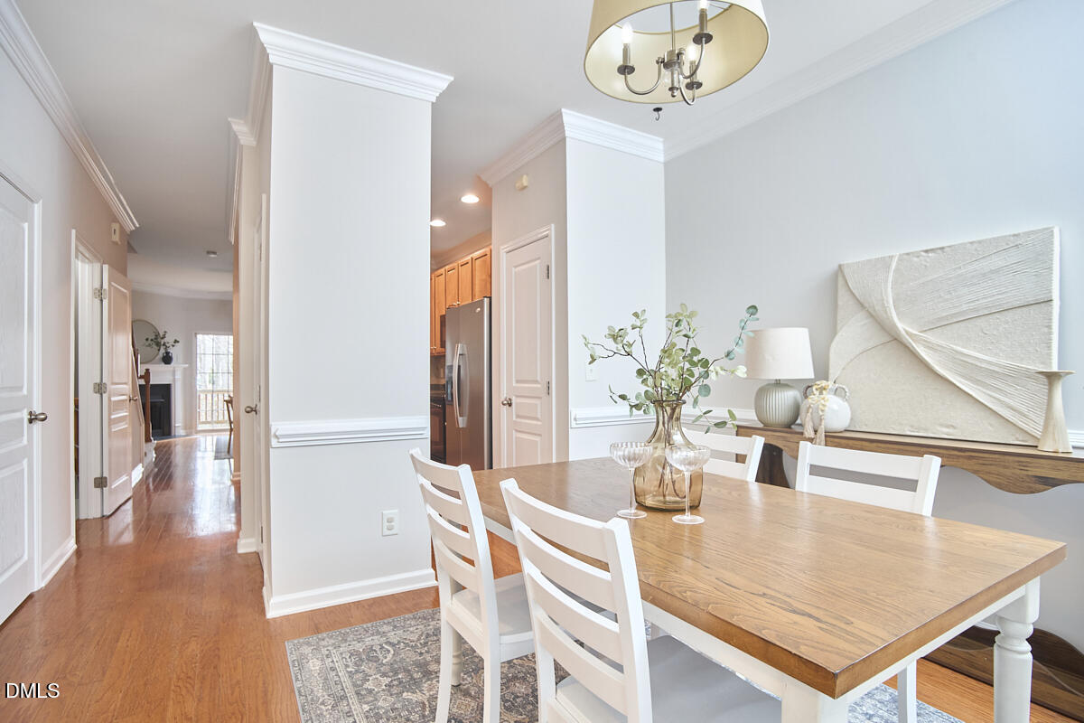 638 Cupola Drive Raleigh, NC 27603 - Photo 6 of 43 a view of a dining room with furniture and wooden floor