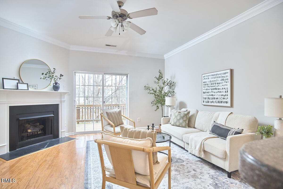 638 Cupola Drive Raleigh, NC 27603 - Photo 10 of 43 a living room with furniture and a fireplace