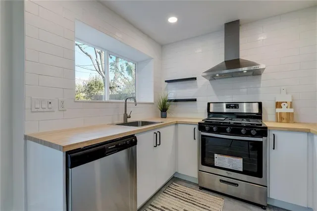 a kitchen with a stove and a sink