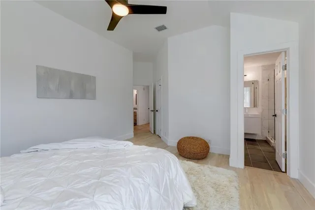 a bedroom with a bed and cabinets