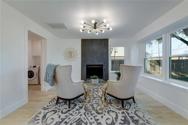 a view of a livingroom with furniture a fireplace