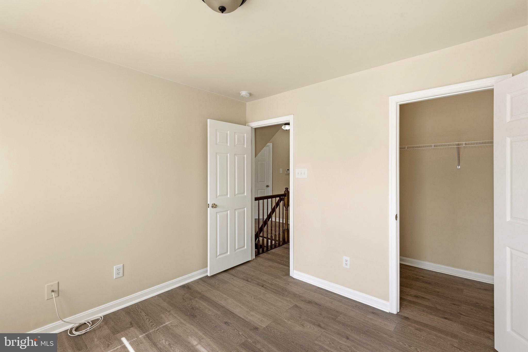 4704 Denview Way Baltimore, MD 21206 - Photo 20 of 42 a view of an empty room with wooden floor and closet