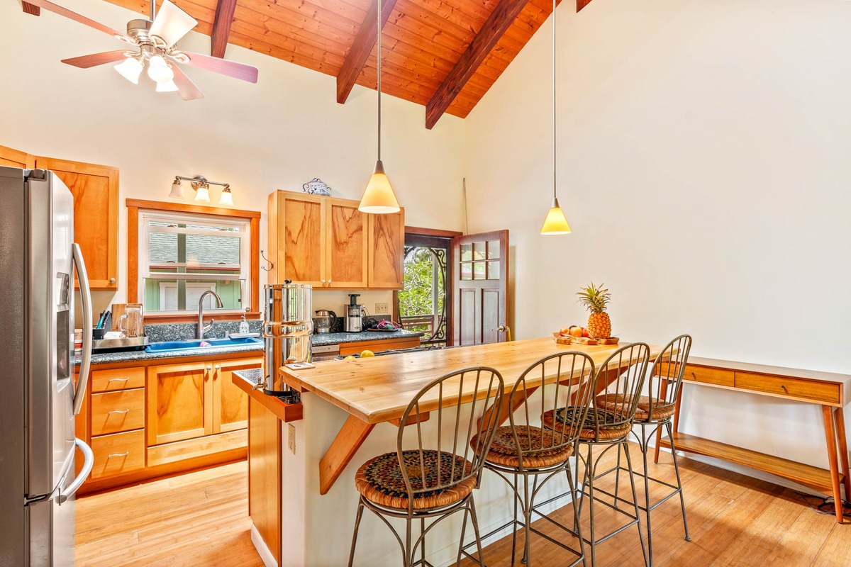 6431 Puupilo Road Kapaa, HI 96746 - Photo 5 of 30 a view of a dining room with furniture a chandelier and kitchen view