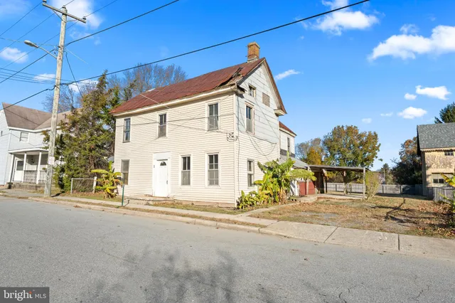 a view of a house with a street
