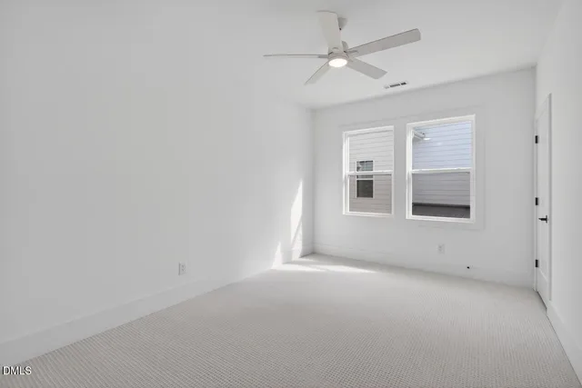 a view of empty room with windows