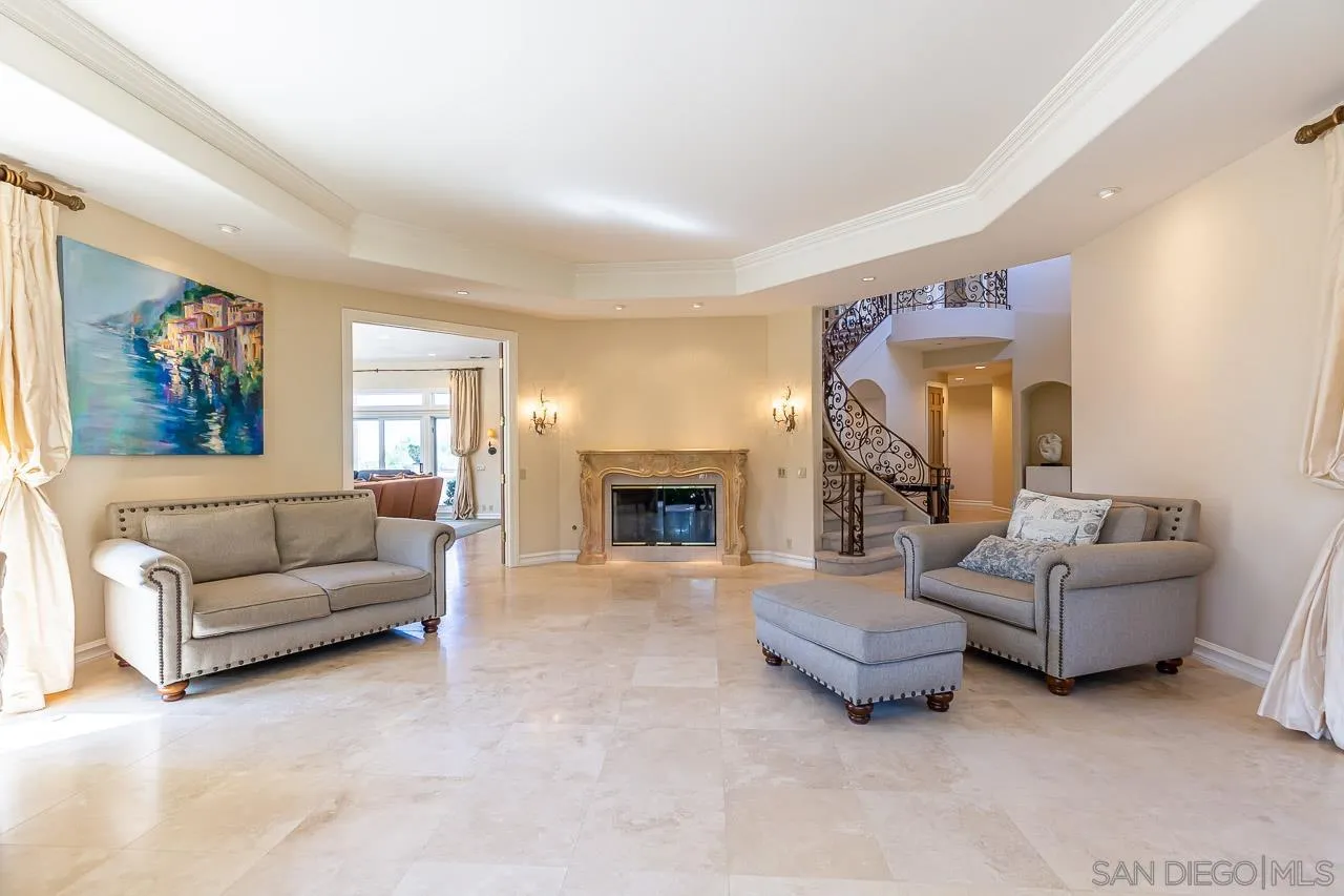 14440 Ridge Ranch Road Valley Center, CA 92082 - Photo 22 of 74 a living room with furniture and a fireplace