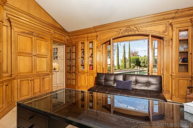 a spacious bedroom with a large bed and a large window