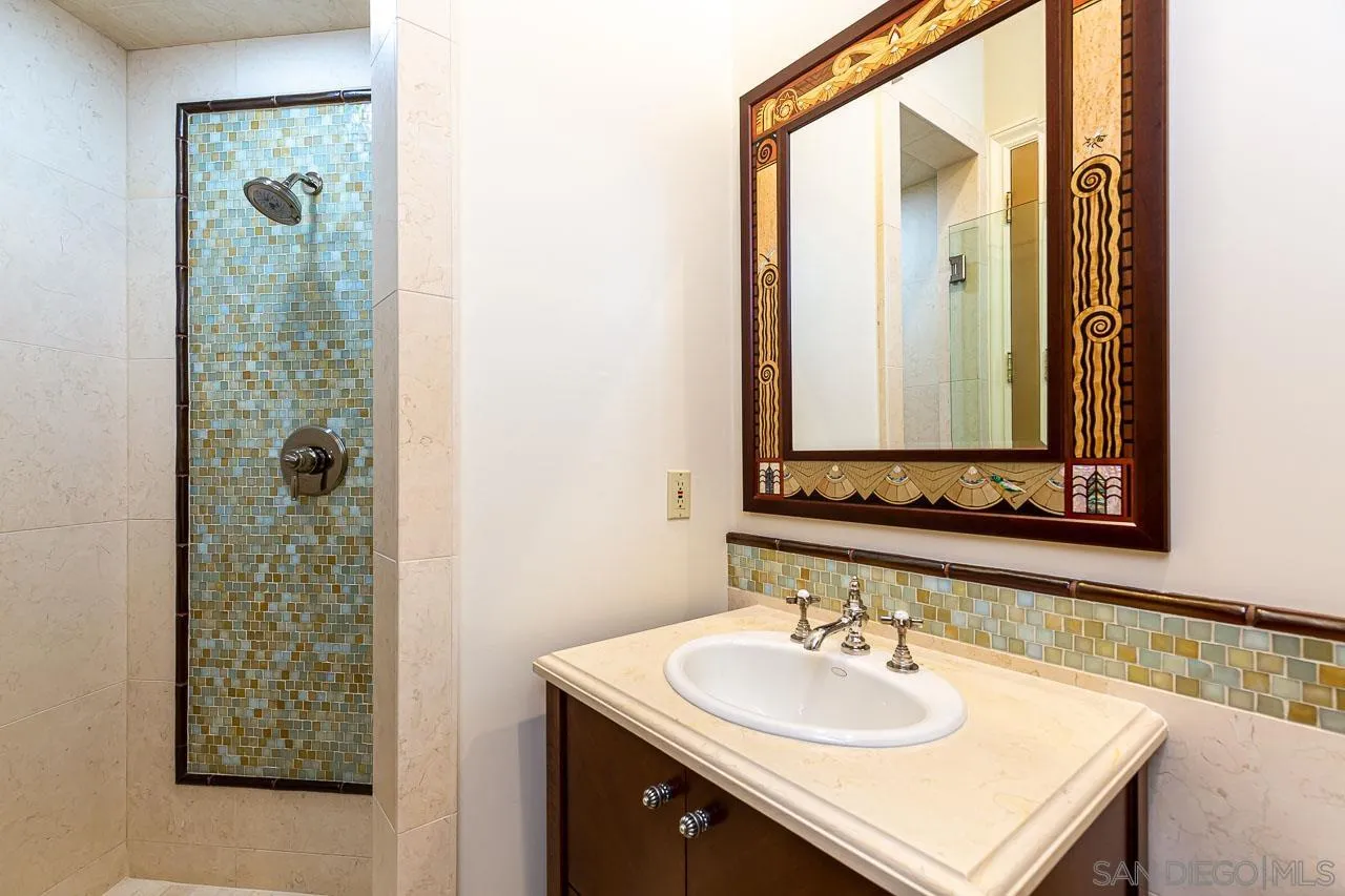 14440 Ridge Ranch Road Valley Center, CA 92082 - Photo 33 of 74 a bathroom with a sink and a mirror