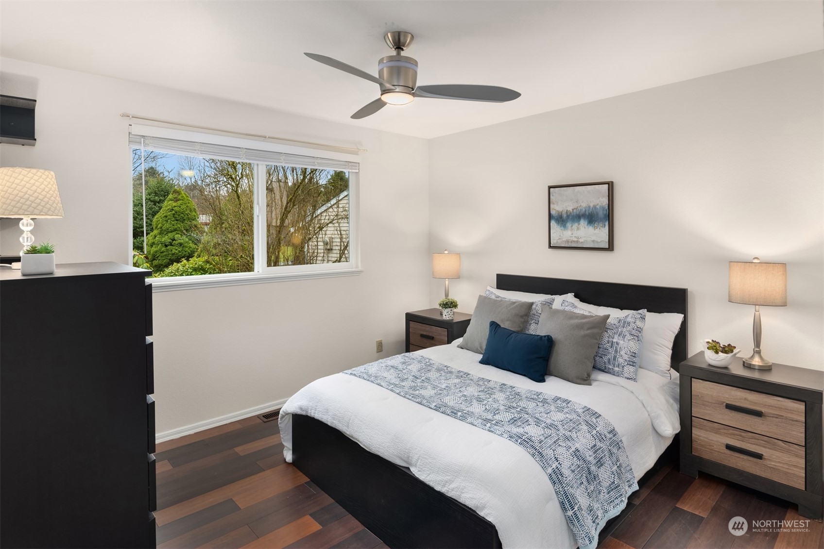 22327 19th Avenue Southeast Bothell, WA 98021 - Photo 13 of 22 a bedroom with a bed and a painting on the wall