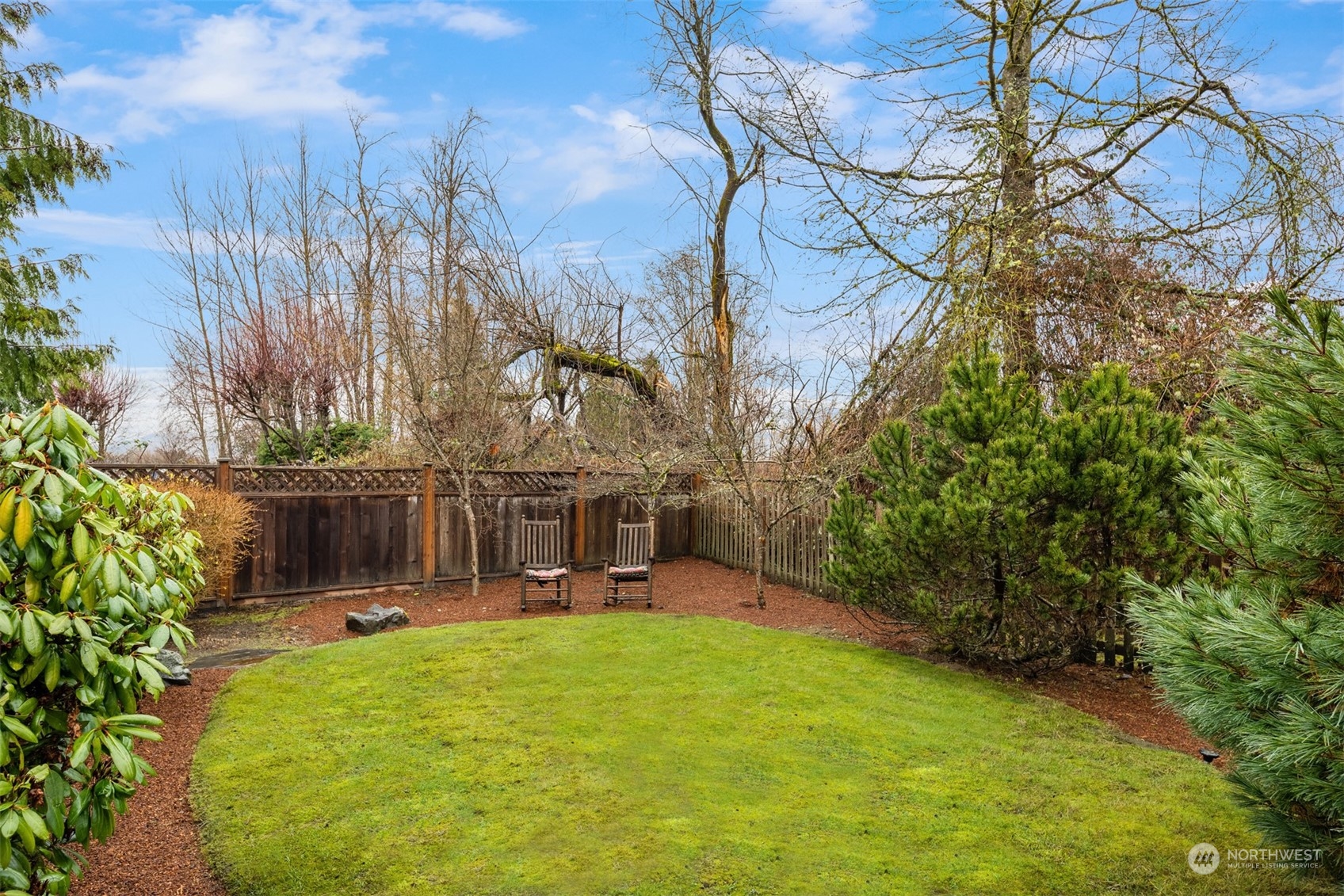 22327 19th Avenue Southeast Bothell, WA 98021 - Photo 19 of 22 a view of a chair and table in backyard