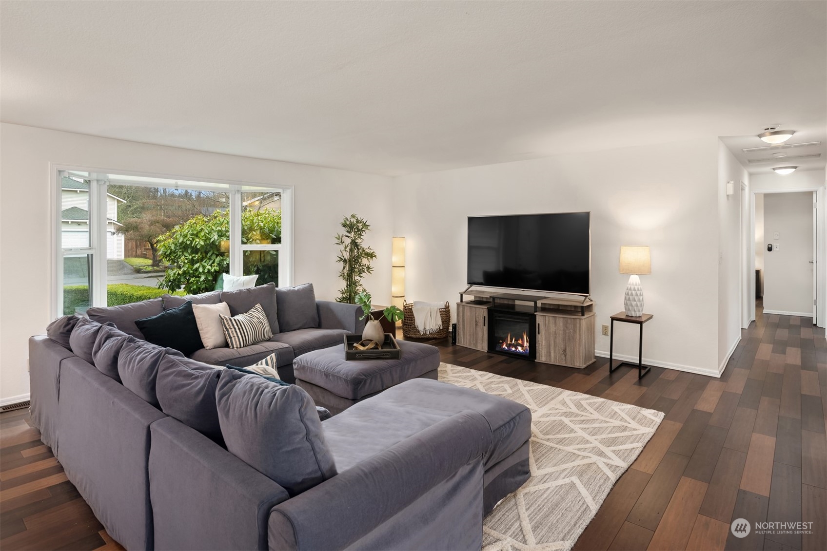 22327 19th Avenue Southeast Bothell, WA 98021 - Photo 3 of 22 a living room with furniture and a flat screen tv