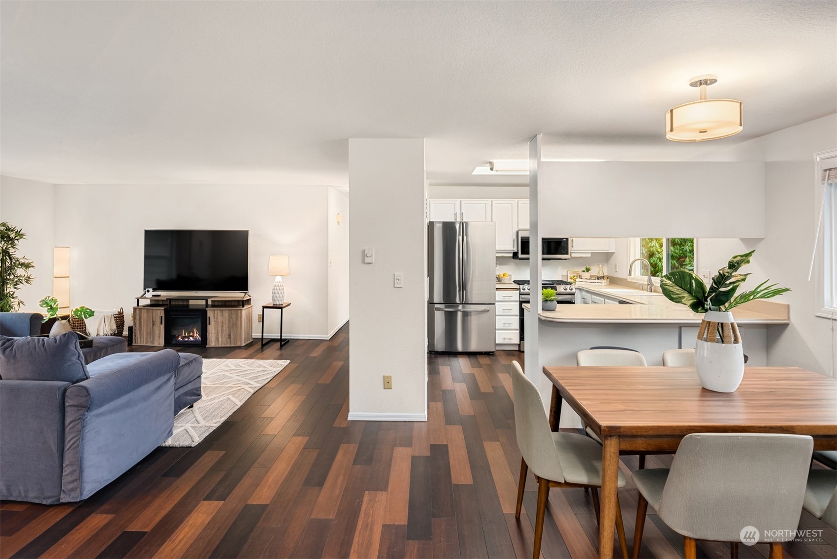 22327 19th Avenue Southeast Bothell, WA 98021 - Photo 8 of 22 a living room with furniture wooden floor and a flat screen tv