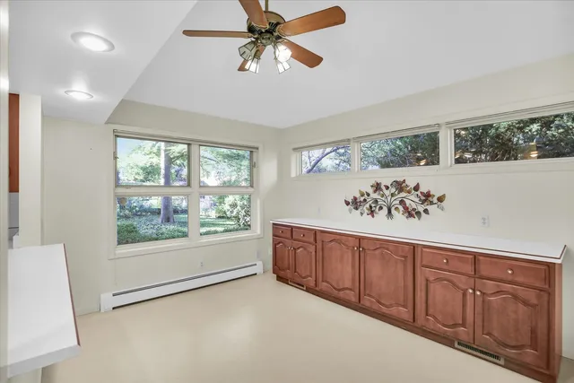 a view of living room with furniture and large window