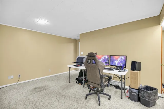 a view of a house with a yard and garage