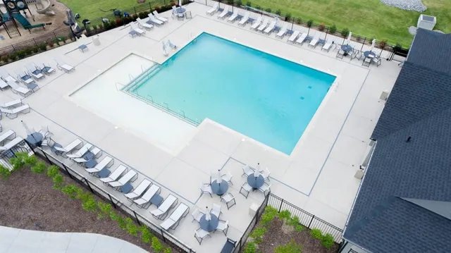 a view of a swimming pool with seating area