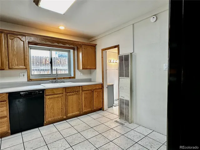 a large kitchen with a window