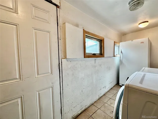 a view of a backyard with sitting area and furniture