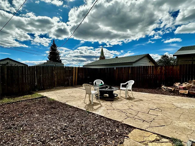 a backyard of a house with seating space