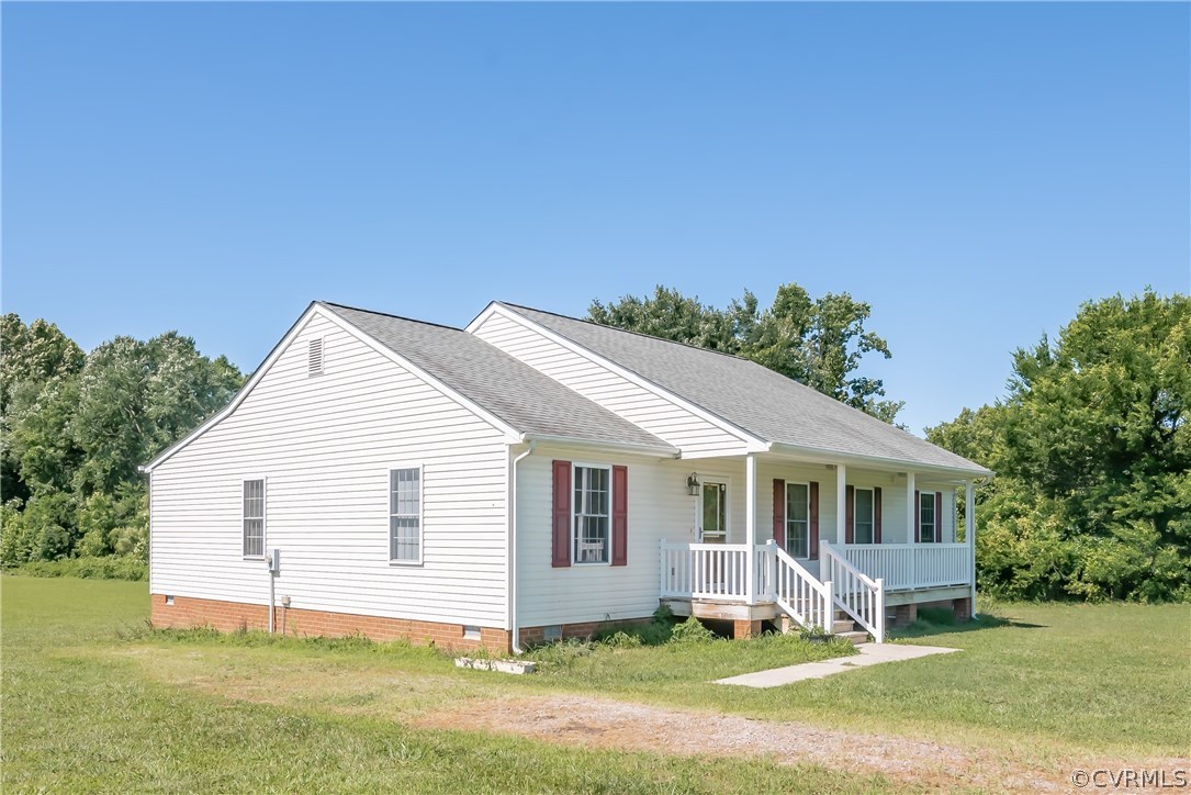 17127 Loving Union Road Disputanta, VA 23842 - Photo 26 of 26 a front view of a house with a yard and garage