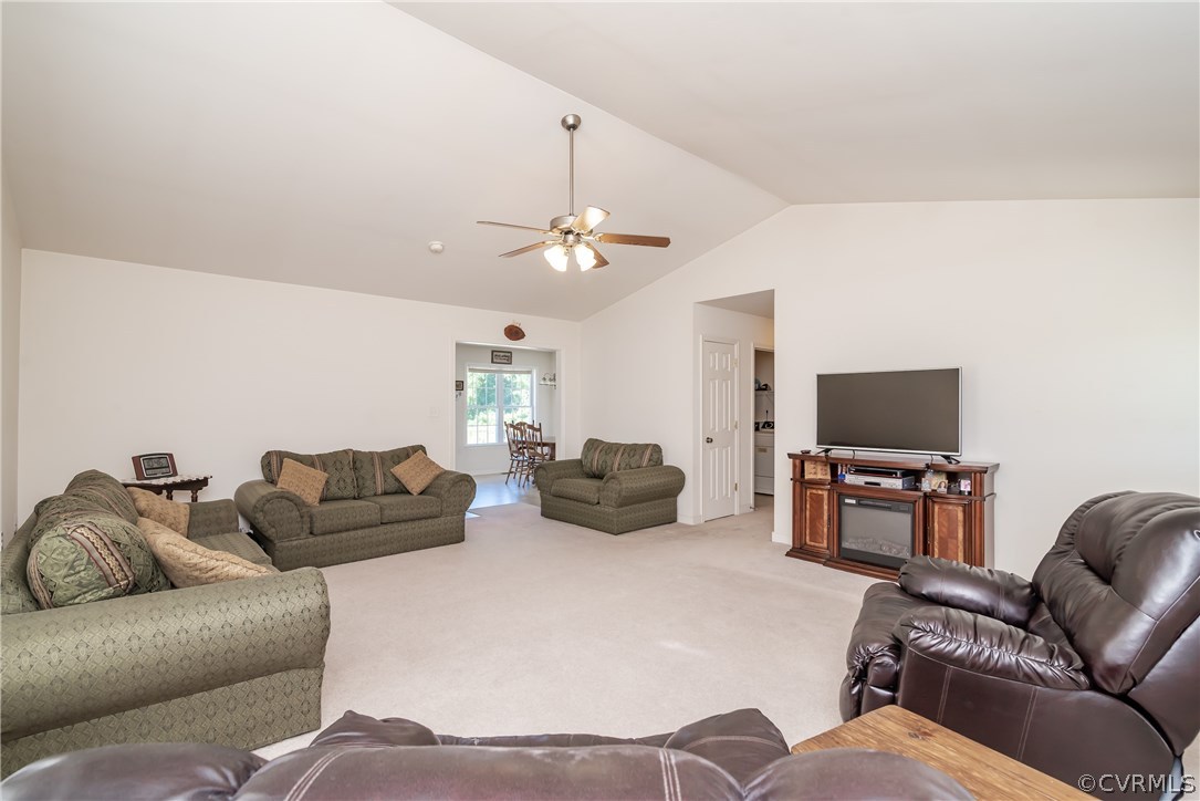 17127 Loving Union Road Disputanta, VA 23842 - Photo 8 of 26 a living room with furniture and a flat screen tv