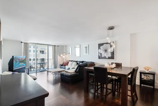 a living room with furniture and a large window