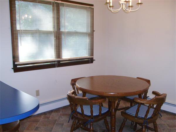 288 Mill Road Fairhaven, MA 02719 - Photo 12 of 22 a view of a dining room with furniture and window