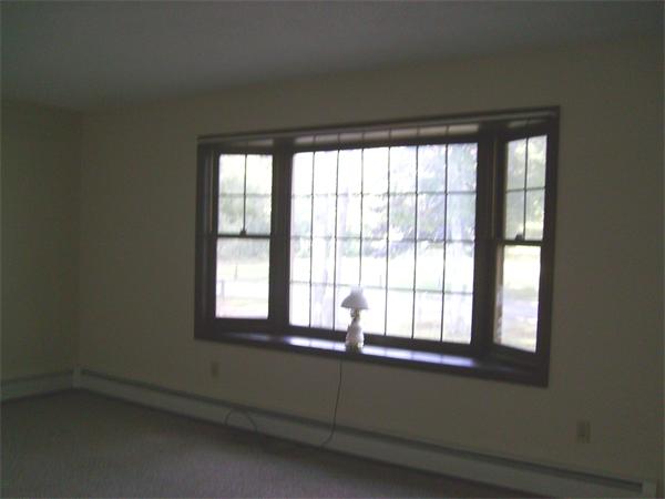 288 Mill Road Fairhaven, MA 02719 - Photo 13 of 22 a view of an empty room with a window