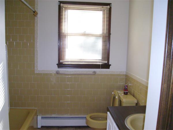 288 Mill Road Fairhaven, MA 02719 - Photo 22 of 22 a bathroom with a toilet sink and mirror