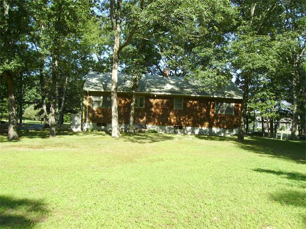 288 Mill Road Fairhaven, MA 02719 - Photo 3 of 22 a view of yard with swimming pool and trees