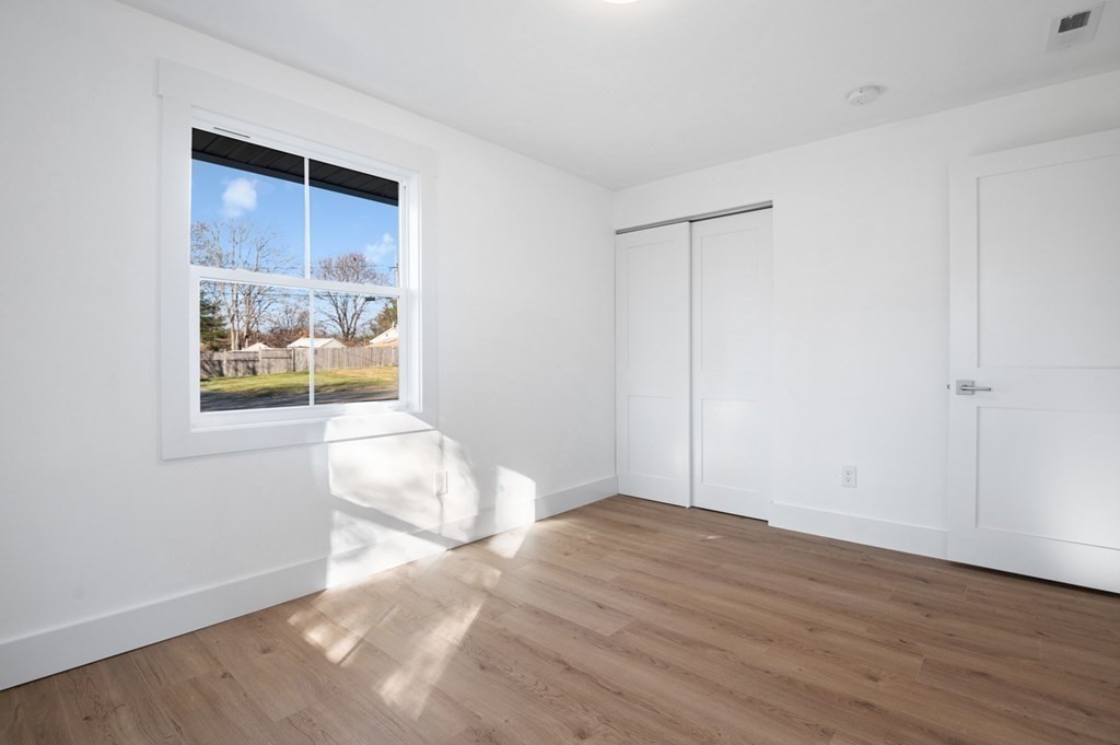 27 Trinity Street Danvers, MA 01923 - Photo 15 of 27 a view of room with window and wooden floor