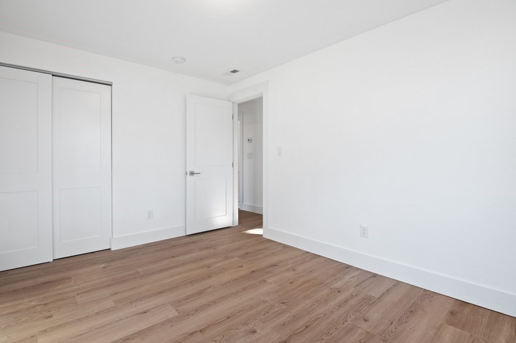 27 Trinity Street Danvers, MA 01923 - Photo 16 of 27 a view of an empty room with wooden floor
