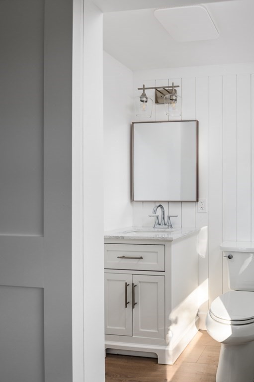 27 Trinity Street Danvers, MA 01923 - Photo 23 of 27 a bathroom with a sink toilet and mirror