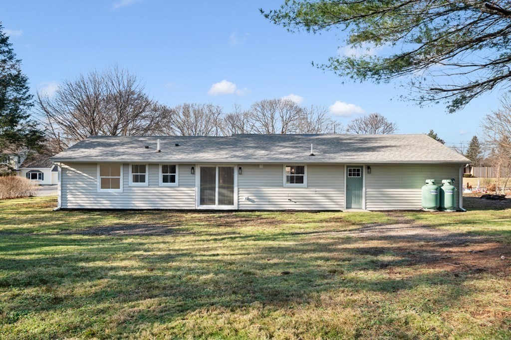 27 Trinity Street Danvers, MA 01923 - Photo 26 of 27 a front view of a house with a yard