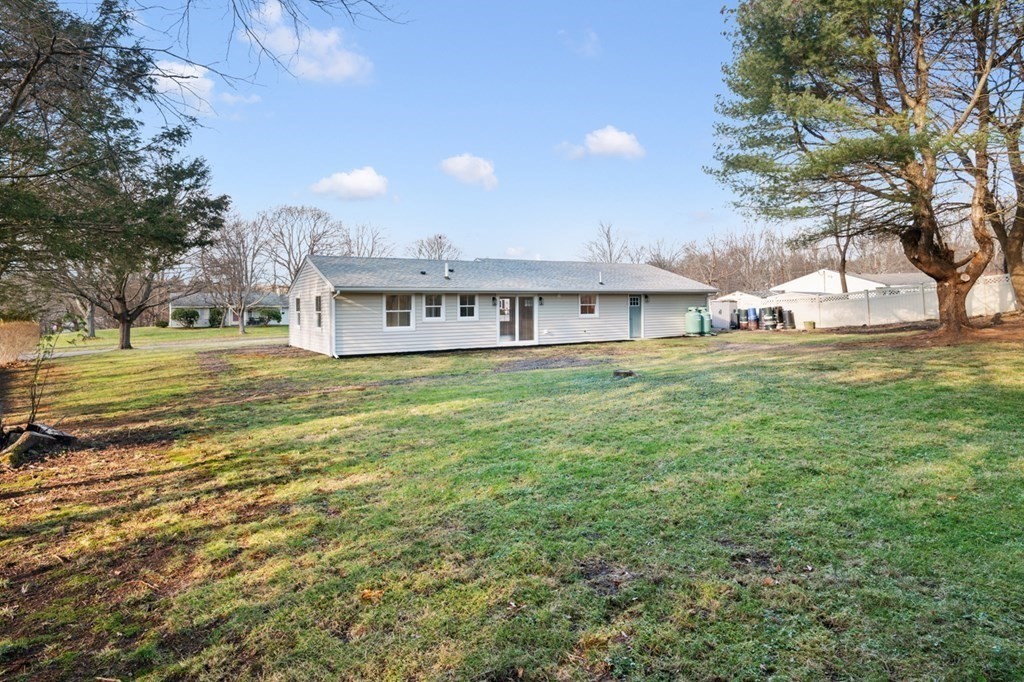 27 Trinity Street Danvers, MA 01923 - Photo 27 of 27 a view of a house with a big yard and large trees