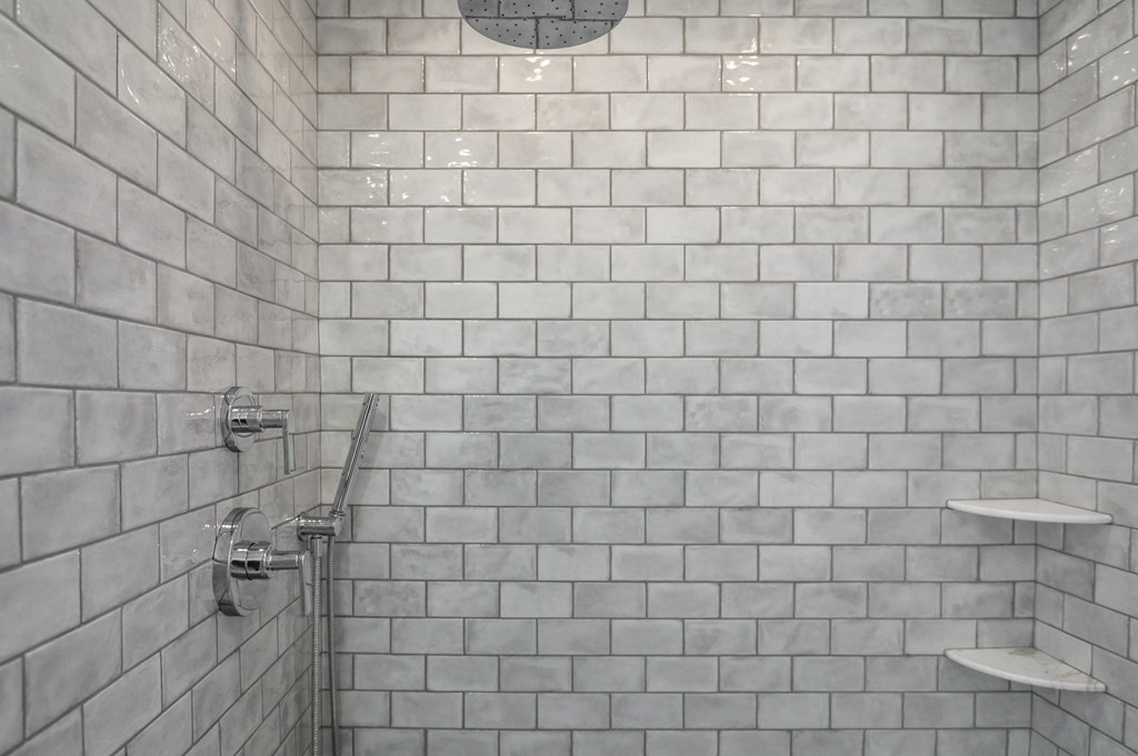 27 Trinity Street Danvers, MA 01923 - Photo 10 of 27 a bathroom with a white shower