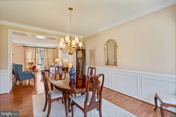 a living room with furniture a fireplace and a large window