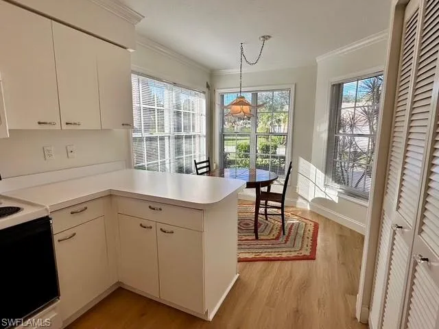 a kitchen that has a cabinets counter space and a stove