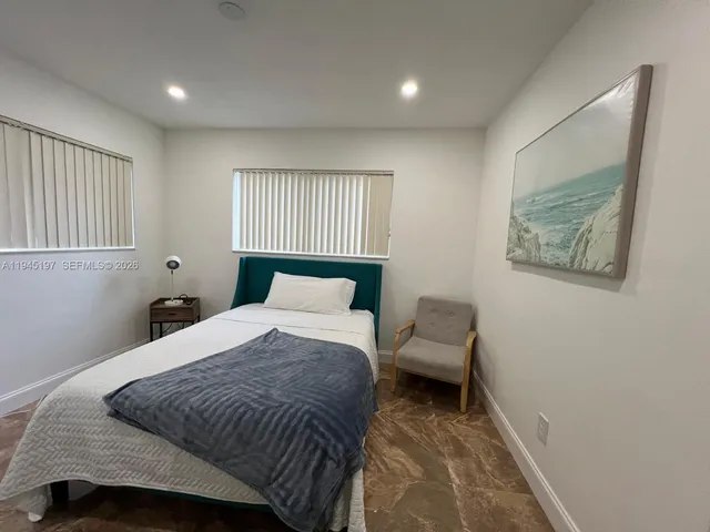 a view of a park with large trees