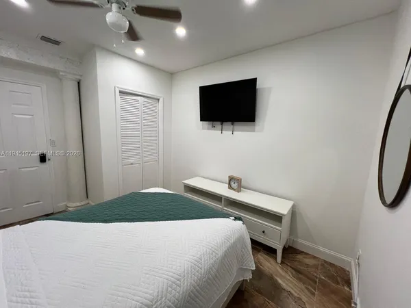 a bathroom with a sink toilet and a mirror