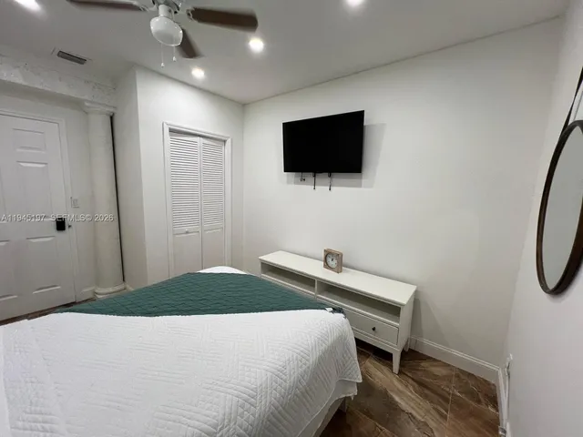 a bathroom with a sink toilet and a mirror
