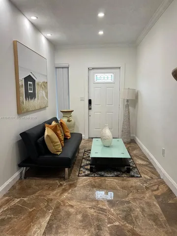 a kitchen with a stove a sink and a microwave