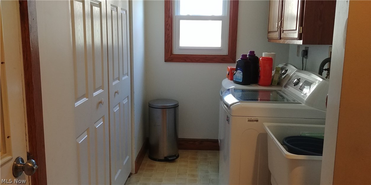 16220 Mason Road Vermilion, OH 44089 - Photo 11 of 29 Laundry Room with Cabinets and Double Closet