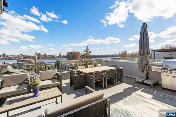a view of a terrace with furniture