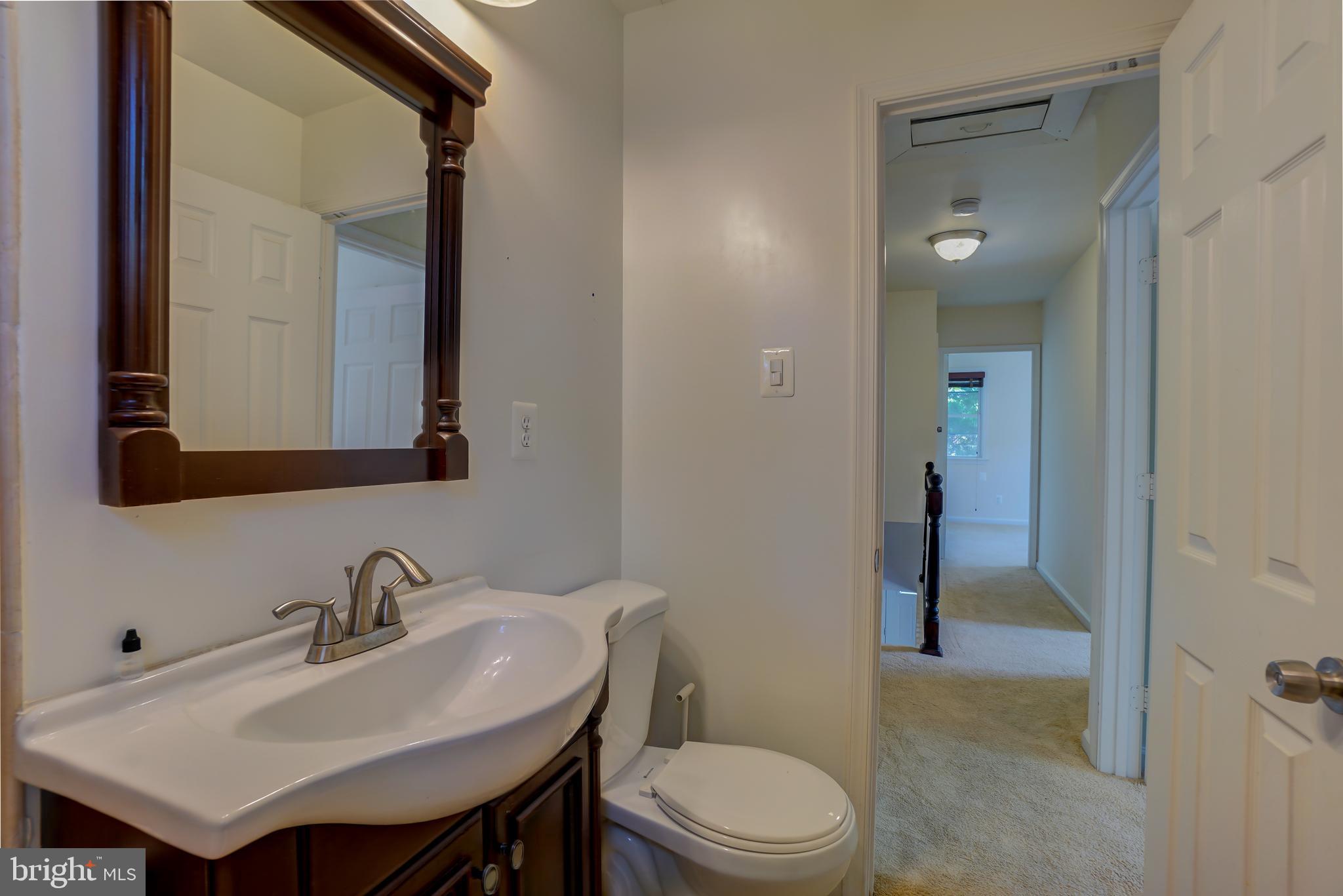 628 Four Mile Road Alexandria, VA 22305 - Photo 21 of 29 a bathroom with a sink a toilet and shower