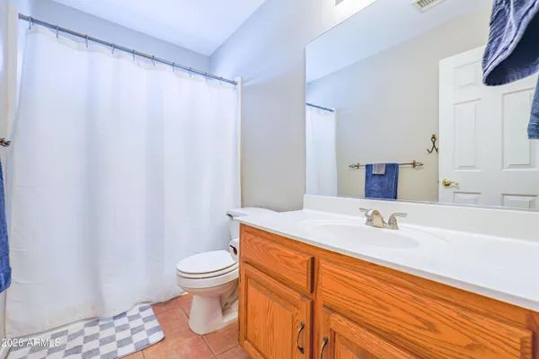 a bathroom with a sink a mirror and a bathtub