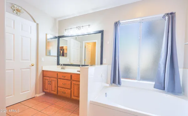 a kitchen with stainless steel appliances granite countertop a refrigerator and a stove