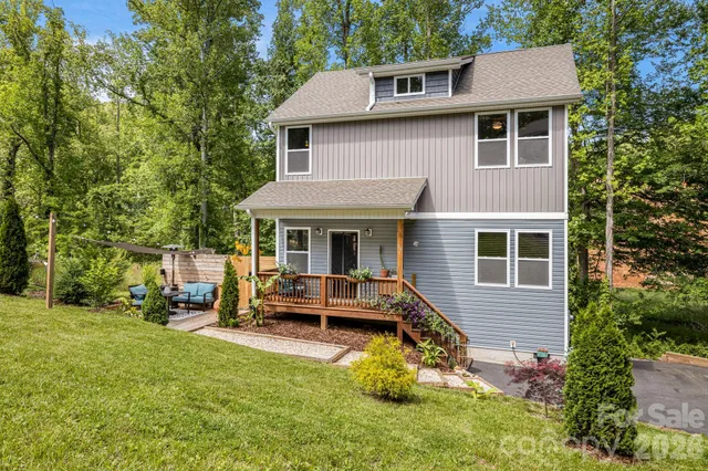 a view of a house with a yard patio and a patio