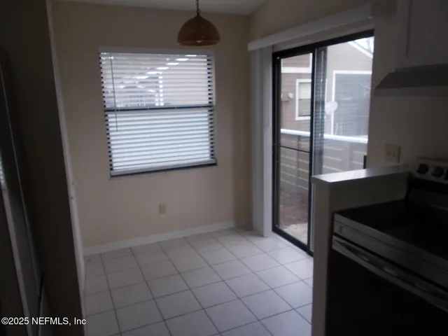 a view of an empty room and window