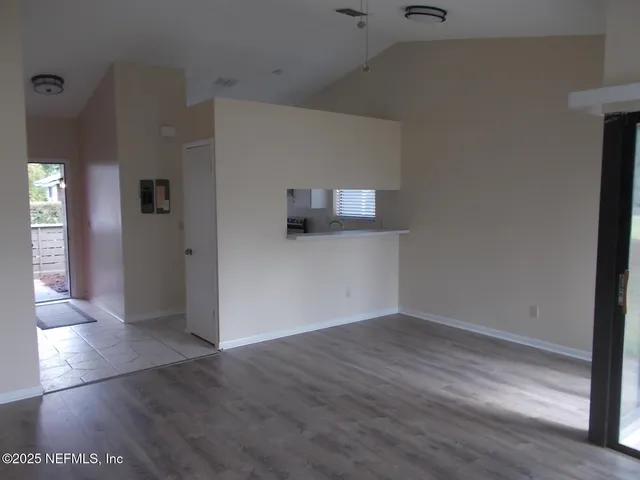 a view of a livingroom with wooden floor