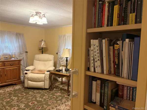 $199,999 | 525-207 Riverleigh Avenue, Unit 207, Riverhead, NY 11901